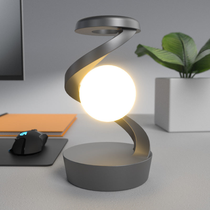 Rotating Moon Desk Lamp with Wireless Phone Charging – Futuristic Glow Meets Modern Functionality