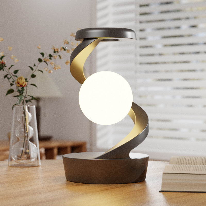 Rotating Moon Desk Lamp with Wireless Phone Charging – Futuristic Glow Meets Modern Functionality