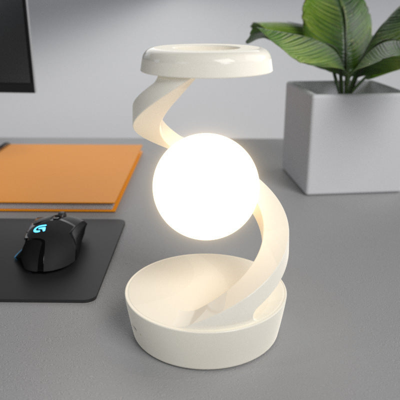 Rotating Moon Desk Lamp with Wireless Phone Charging – Futuristic Glow Meets Modern Functionality