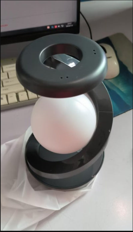 Rotating Moon Desk Lamp with Wireless Phone Charging – Futuristic Glow Meets Modern Functionality